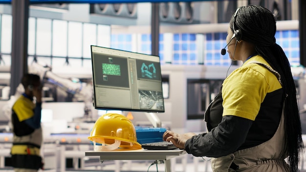 Technician supervising smart-factory production lines