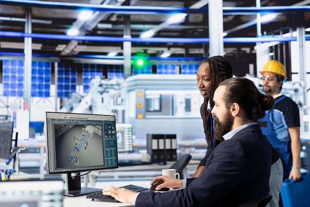 Factory technicians working together to improve efficiency